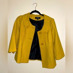 Never worn yellow jacket size S